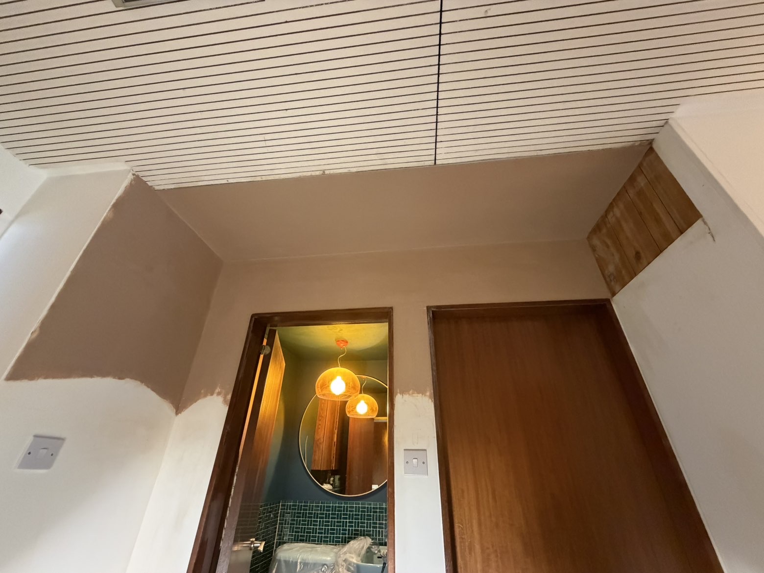 Hallway ceiling patched and skimmed flush