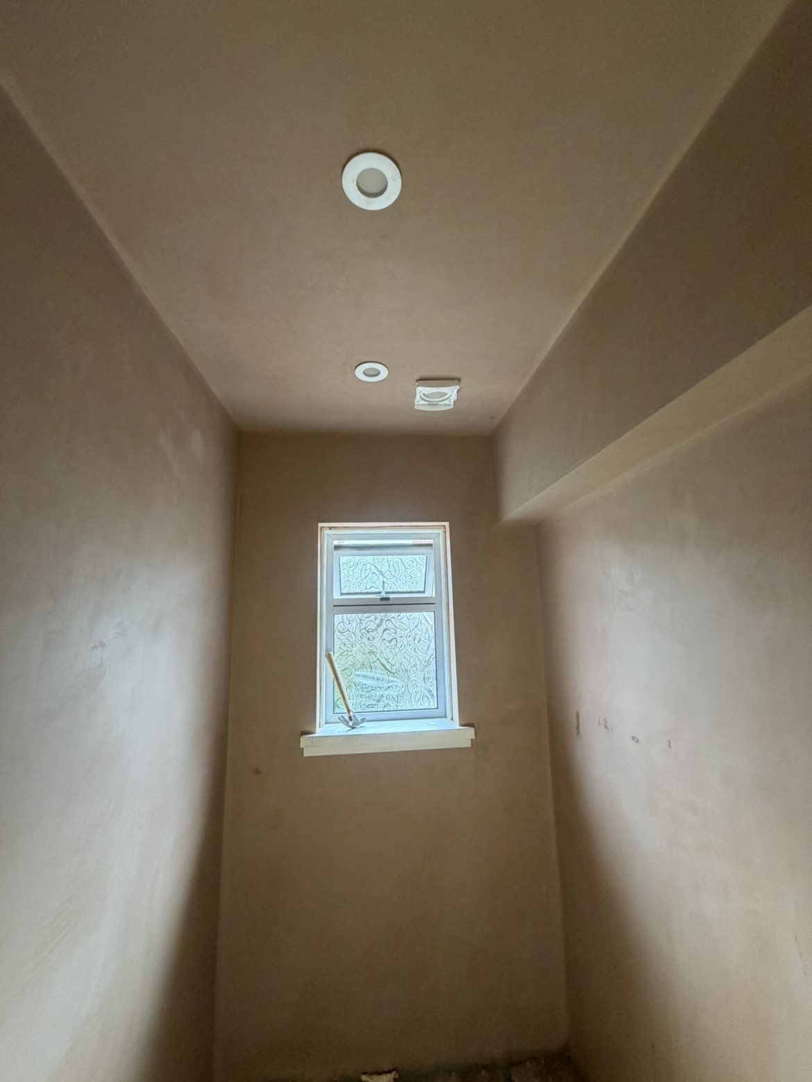 Small room skimmed top to bottom with neat window reveals