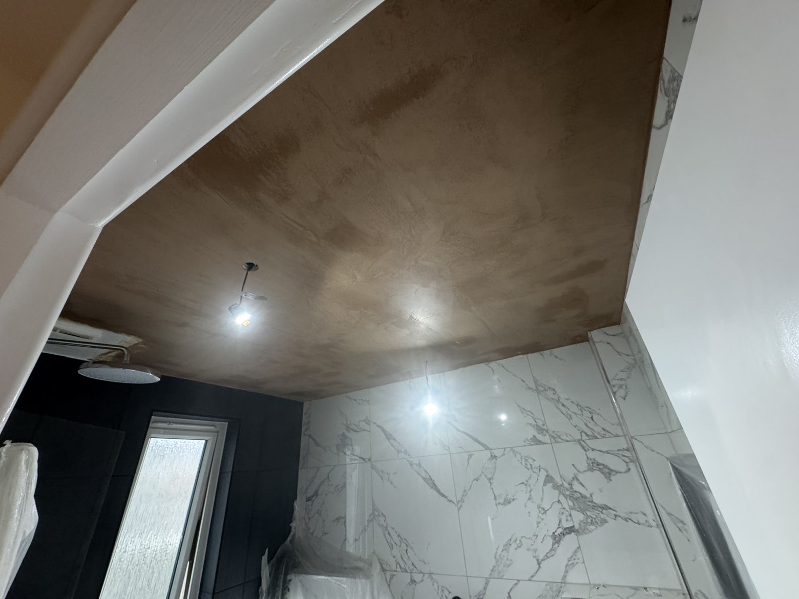 Bathroom ceiling skimmed over tiled walls